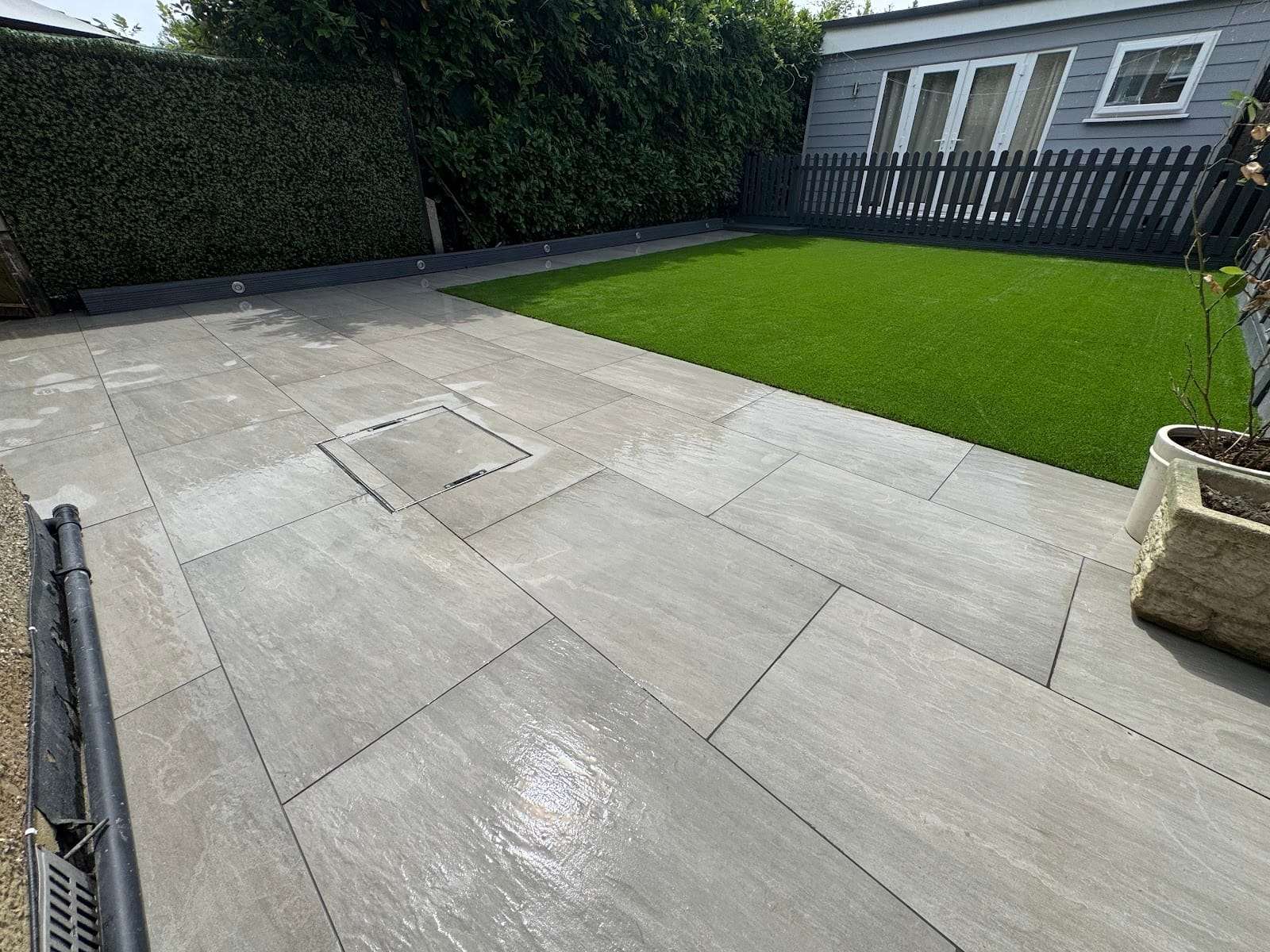 Porcelain patio and lawn, by GRD Landscaping Ltd