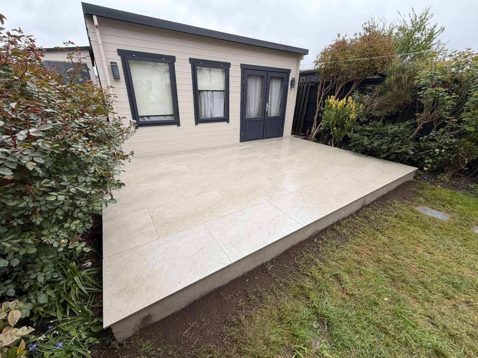 Porcelain patio by garden office, by GRD Landscaping Ltd